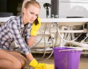 Vigilant Girl Calling To Plumber Shutterstock 224418274